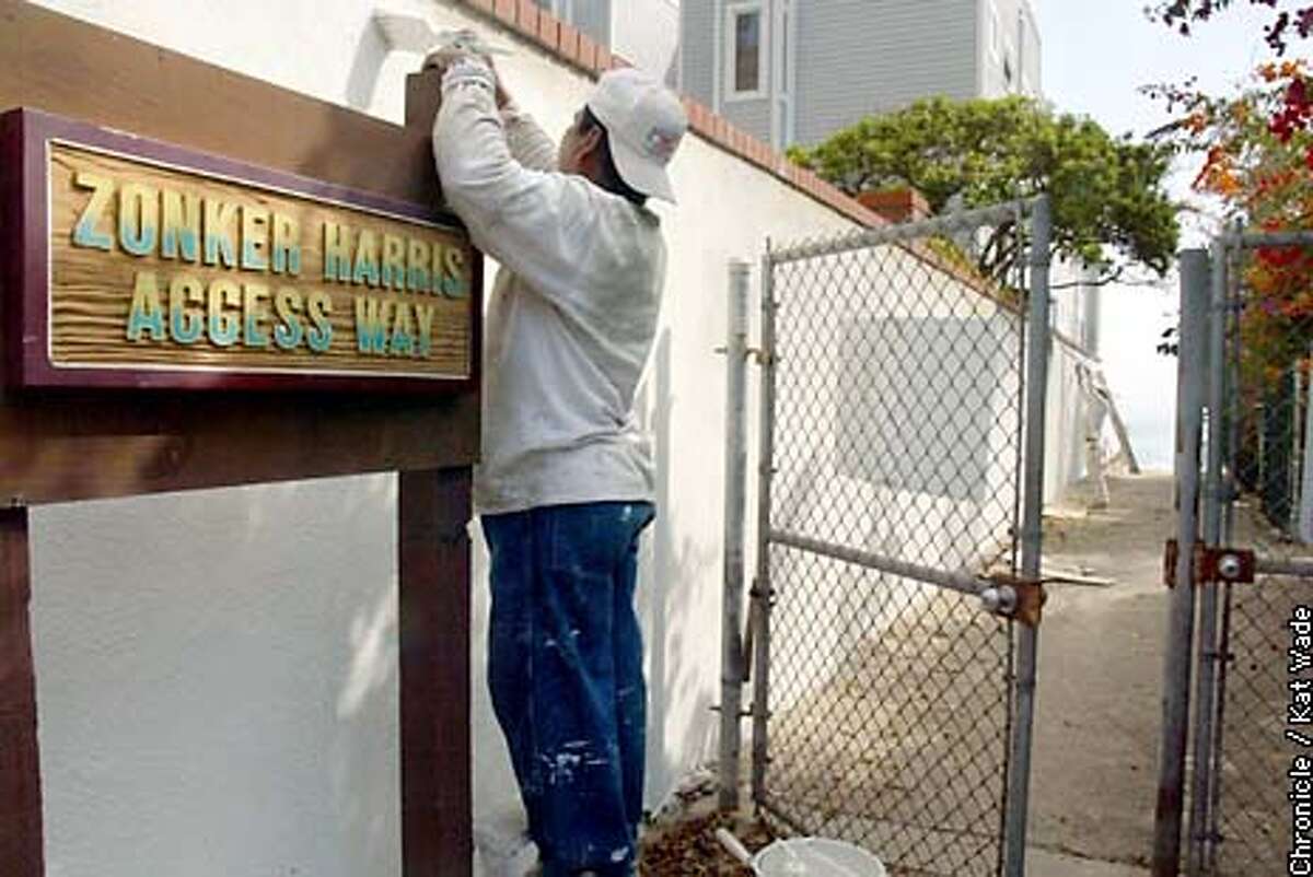 COASTALd-C-24SEP02-MN-KW - (L to R) Carlos Minero and Jason King of Lee's Painting put a fresh coat on the only public access to the Malibu Beach in five miles. SAN FRANCISCO CHRONICLE PHOTO BY KAT WADE