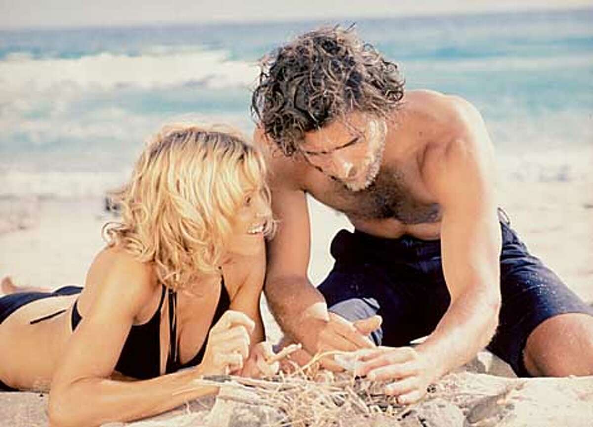High and dry Madonna and Adriano Giannini in "Swept Away," based on Lina Wertmuller's 1974 film and directed by Madonna's husband, Guy Ritchie. Photo by Daniel Smith