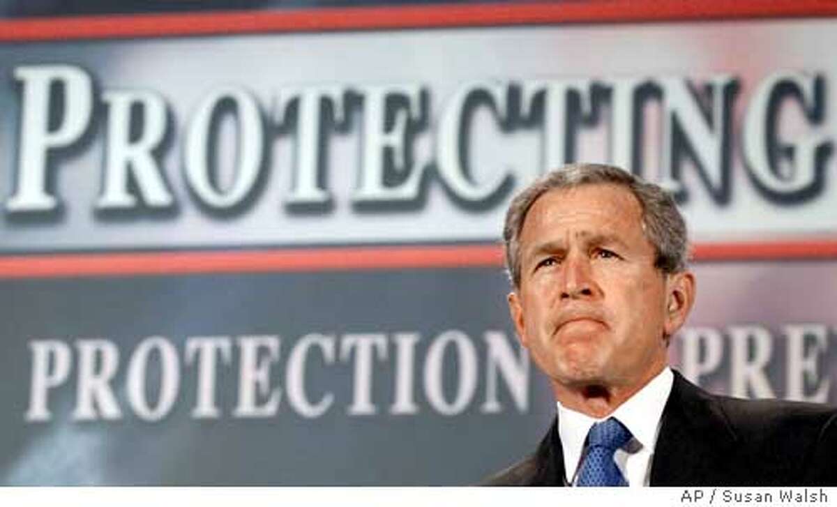 President Bush pauses as he is introduced to deliver his remarks on the Patriot Act in Buffalo, N.Y., Tuesday, April 20, 2004. Making the Patriot Act a theme in his bid to win a second term, Bush is decrying any proposed weakening of the law he calls central to fighting terrorism. For the second day in a row, the president is making a strong public defense of the Patriot Act, this time in Buffalo, the site of recent criminal cases against the Lackawanna Six. The six Yemeni-Americans pleaded guilty to supporting terrorism by briefly attending al-Qaida training camps in Afghanistan. (AP Photo/Susan Walsh)