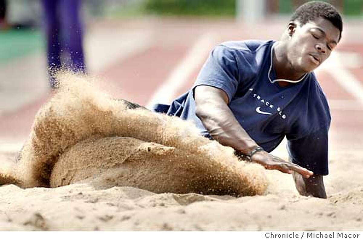 Sand goes flying as Triple Jumper Angelo Jeffery hits the pit during practice one day before a meet. James Logan High School in Union City has several track and fieild athletes who have some of the best marks in the Bay Area if not the State. event on 4/20/04 in Union City Michael Macor / San Francisco Chronicle