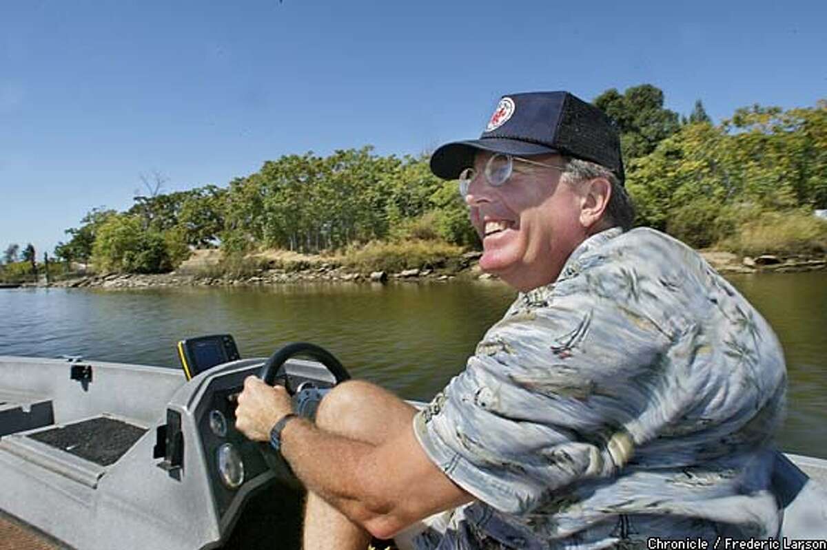 Lou Jones, owner of a Napa medical equipment company, takes a day off cruising the Napa River in his powerboat. Chronicle photo by Frederic Larson
