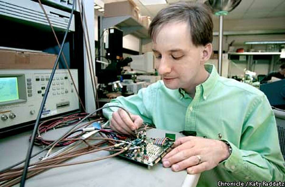 PHOTO BY KATY RADDATZ--THE CHRONICLE Sun Microsystems has a lot invested in R&D--we go to Sun Micro Labs to find Robert Drost probing signals on a research prototype test board testing a high speed communication chip.