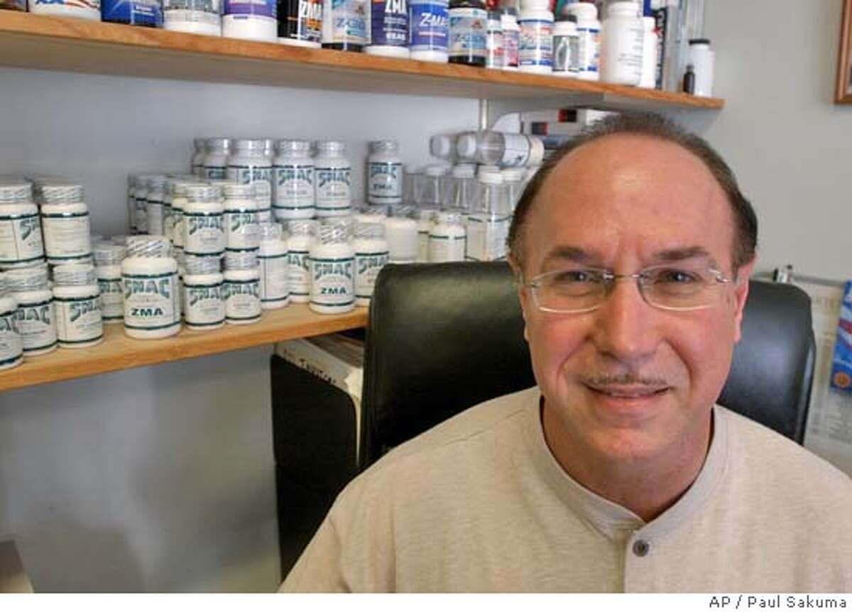 ** FILE **BALCO founder Victor Conte, Jr. is shown in his office in Burlingame, Calif., in this Oct. 21, 2003 photo. Conte., the president and chief executive officer of the Bay Area Lab Cooperative, and it's vice president, James J. Valente, along with personal trainer Greg F. Anderson and track coach Remi Korchemny, were indicted by a grand jury in San Francisco Thursday, Feb. 12, 2004. The charges include conspiracy to distribute steroids, possession of human growth hormone, misbranding drugs with intent to defraud and money laundering. (AP Photo/Paul Sakuma) ProductNameChronicle U.S. Attorney General John Ashcroft, flanked by San Mateo County Sheriff Don Horsley (left) and Kevin Ryan, U.S. Attorney for the Northern District of California, announces the federal indictments in the BALCO case. U.S. Attorney General John Ashcroft, flanked by San Mateo County Sheriff Don Horsley (left) and Kevin Ryan, U.S. Attorney for the Northern District of California, announces the federal indictments in the BALCO case. Greg Anderson, Barry Bonds personal trainer since 1998. ProductNameChronicle