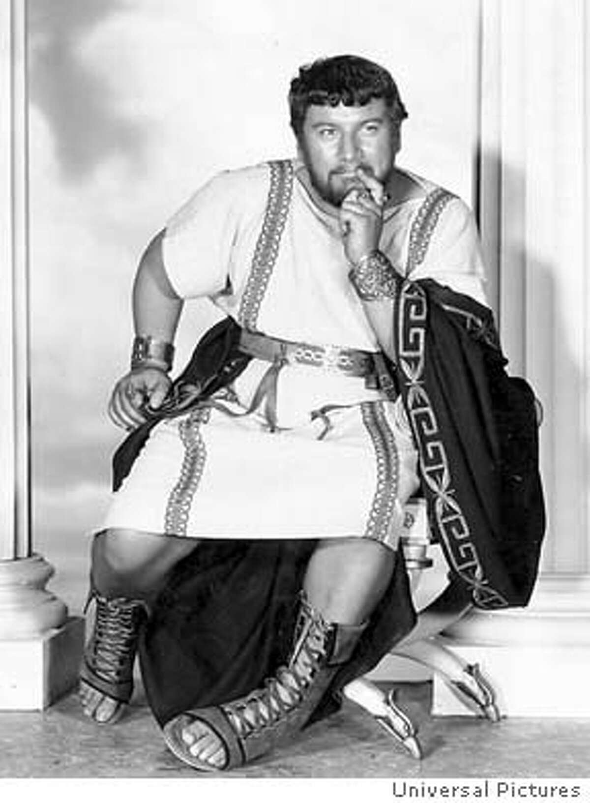 (NYT15) UNDATED -- March 29, 2004 -- OBIT-USTINOV-B&W -- Peter Ustinov, the hair-trigger wit with the avuncular charm whose 60-year-career amounted to a revovling series of star turns as actor, playwright, novelist, director and raconteur, died Sunday at a clinic near his home in Bursins, Switzerland. He was 82. Ustinov as Lentulus Batiatus in the 1960 film "Spartacus." Ustinov won an Oscar for best supporting actor in the film. (Universal Pictures/The New York Times)