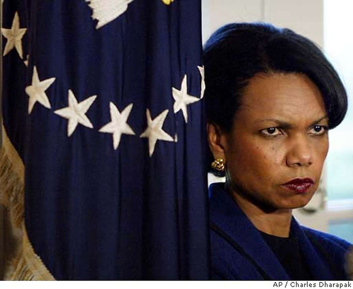 National Security Adviser Condoleezza Rice listens to President Bush as he answers reporters' questions at the end of a Cabinet meeting at the White House Tuesday, March 23, 2004 in Washington. The White House on Thursday, March 25, 2004, asked the independent commission investigating the Sept. 11 terrorist attacks to give national security adviser Condoleezza Rice another opportunity to talk privately with panel members.(AP Photo/Charles Dharapak)