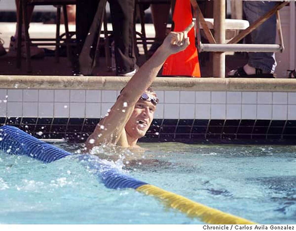 Stanford's Marcus Rogan, celebrates after he broke the meet record in the 200 Individual Medley at the Santa Clara Invitational International Swim Meet in Santa Clara on June 30, 2002. (CARLOS AVILA GONZALEZ/SAN FRANCISCO CHRONICLE) MARKUS ROGAN