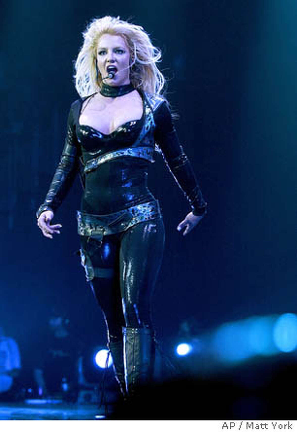 Britney Spears performs during the second show of her ' Onyx Hotel Tour ' March 3, 2004 at Glendale Arena in Glendale, Ariz. Spears will tour numerous cities in North America before visiting Europe, Latin America and Asia throughout 2004 as she promotes her multi platinum album 'In the Zone.' (AP Photo/Matt York)
