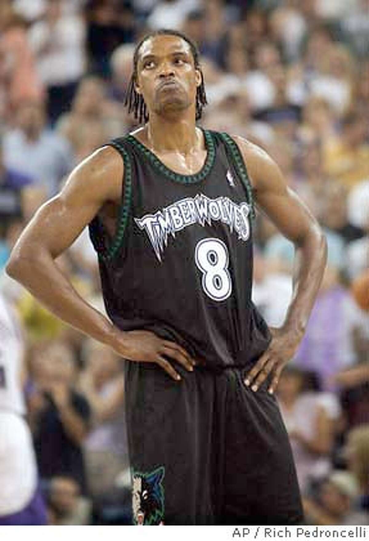Minnesota Timberwolves forward Latrell Sprewell stares up into the crowd in the closing seconds of the Timberwolves' 104-87 loss to the Sacramento Kings in Game 6 of a Western Conference semifinal series in Sacramento, Calif., Sunday, May 16, 2004. The teams head to Minnesota for Wednesday's deciding game. (AP Photo/Rich Pedroncelli)