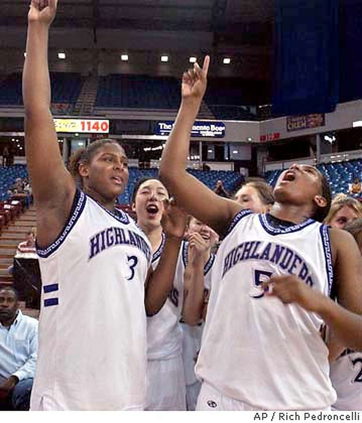 Piedmont's Ashley Paris, right, lets out a shout as she and her sister, Courtney, left, join the team in celebration after Piedmont defeated La Jolla Country Day, 60-51, for the girls' Division IV CIF state championship in Sacramento, Calif., Friday, March 19, 2004. (AP Photo/Rich Pedroncelli)