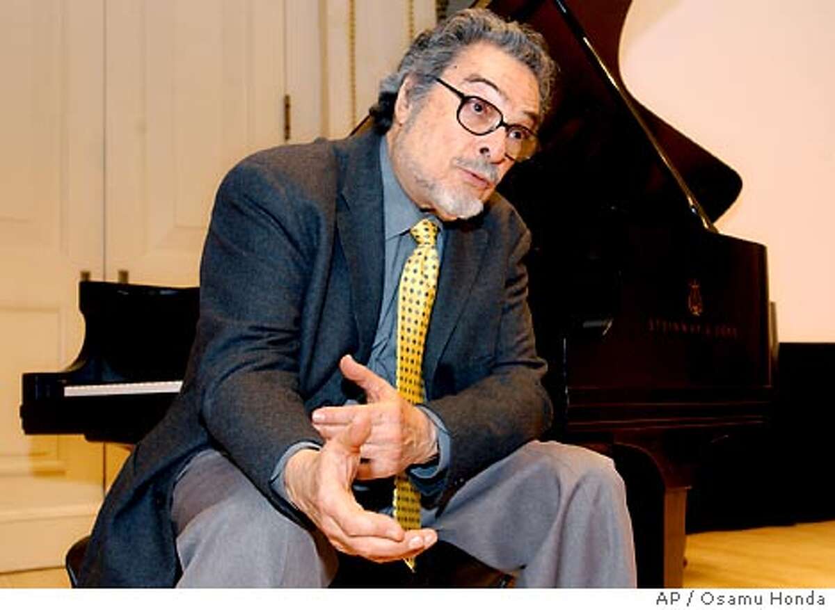 Leon Fleisher sits at a piano during a news conference Wednesday, March 31, 2004, at Carnegie Hall in New York. Fleisher, 75, who for years was able to perform using only his left hand because of a mysterious disease called dystonia, a neurological disorder of the brain which disrupts motor control of muscles, has been treated effectively with botox. (AP Photo/Osamu Honda)