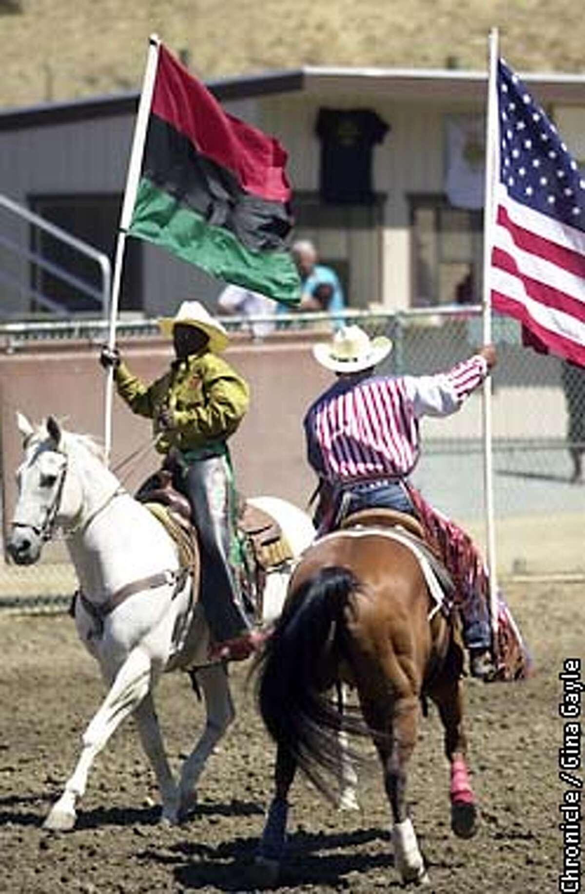 During the Grand Entry of the Bill Pickett Invitational Rodeo, the African flag and the American flag were brought into the stadium. This year the California State Fair has chosen to eliminate the Black rodeo and replace it with a multiculteral rodoe which has caused controversy. Photo by Gina Gayle/The SF Chronicle.