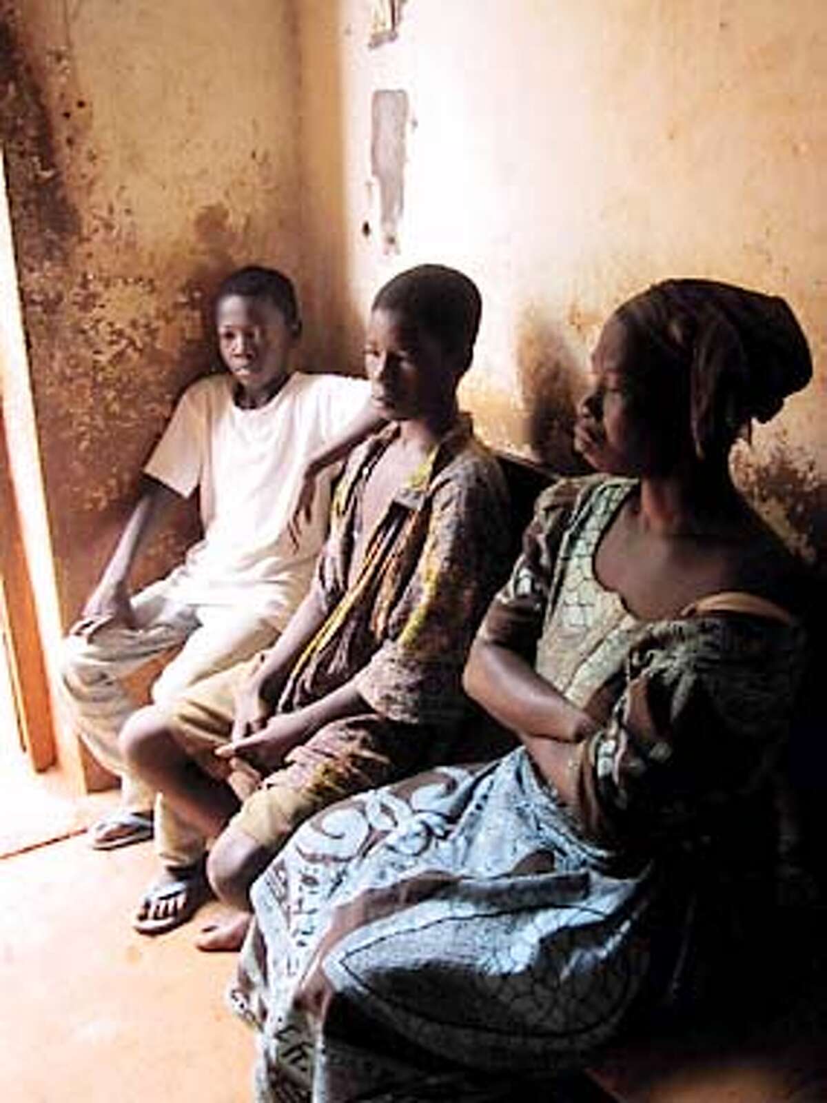 Blaise Damagoa and other accused "witches" wait to be questioned at the police station in Bangui, Central African Republic. Photo by Lucy Jones, special to the Chronicle