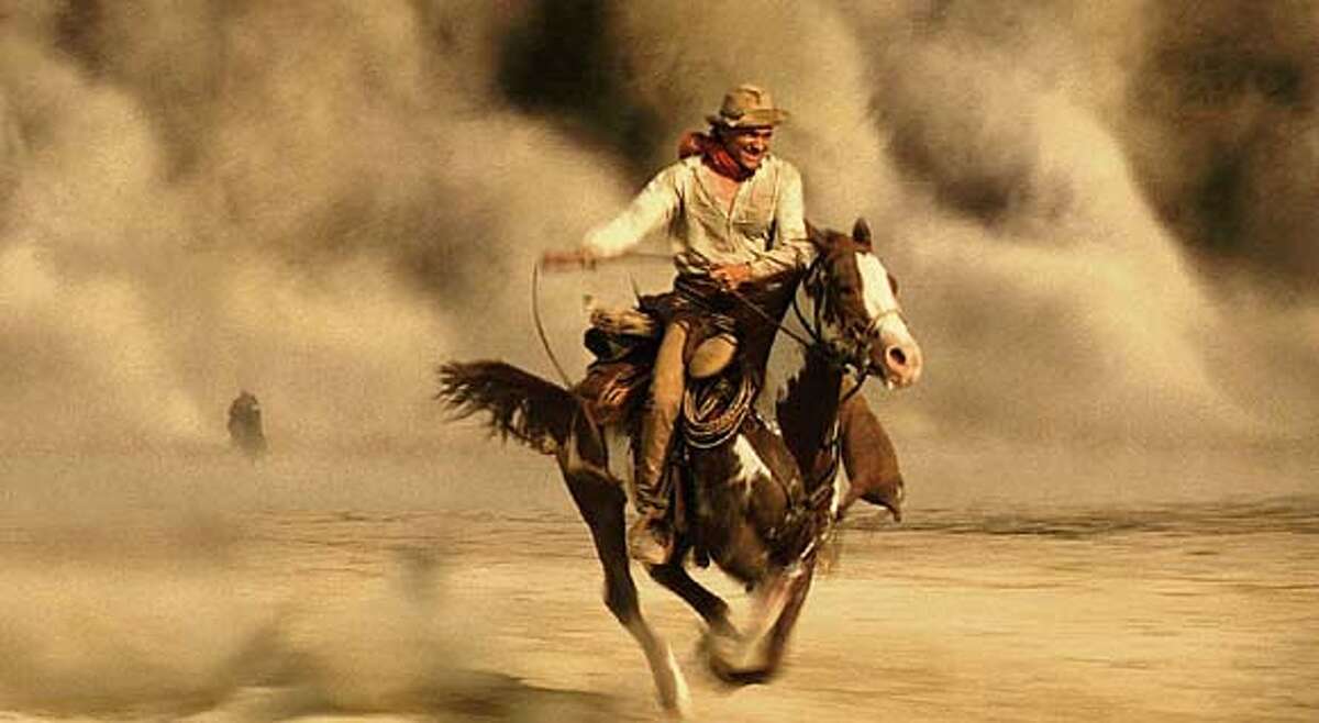 A stranger in a strange land, American distance rider Frank T. Hopkins (Viggo Mortensen, pictured) and his horse, Hidalgo, face many strange events including a sandstorm as they compete in the Ocean of Fire, a 3,000-mile race across the Arabian desert, in Touchstone Pictures action-adventure Hidalgo. (AP Photo/ILM)