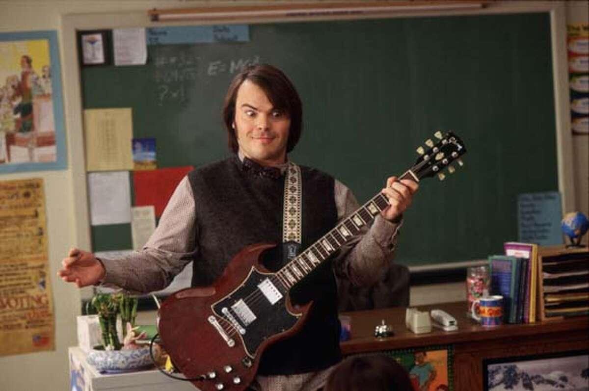 Actor Jack Black portrays a down and out rock star Dewey Finn who gets fired from his band and who faces a mountain of debts and depression in a scene from his new comedy film "School of Rock" in this undated publicity photograph. The film opens September 26 in the United States. REUTERS/Paramount Pictures/Handout ALSO RAN 10/03/03 CAT Datebook#Datebook#Train#09/29/03#ALL#Advance#D1#0421409325 Photo caption presstest171064361600X80001Actor Jack Black portrays a down and out rock star Dewey Finn who gets fired from his band and who faces a mountain of debts and depression in a scene from his new comedy film "School of Rock" in this undated publicity photograph. The film opens September 26 in the United States. REUTERS-Paramount Pictures-Handout____CAT Datebook#Datebook#Train#09-29-03#ALL#Advance#D1#0421409325 Jack Black plays a down-and-out musician who poses as a substitute teacher after getting fired from his band in School of Rock.