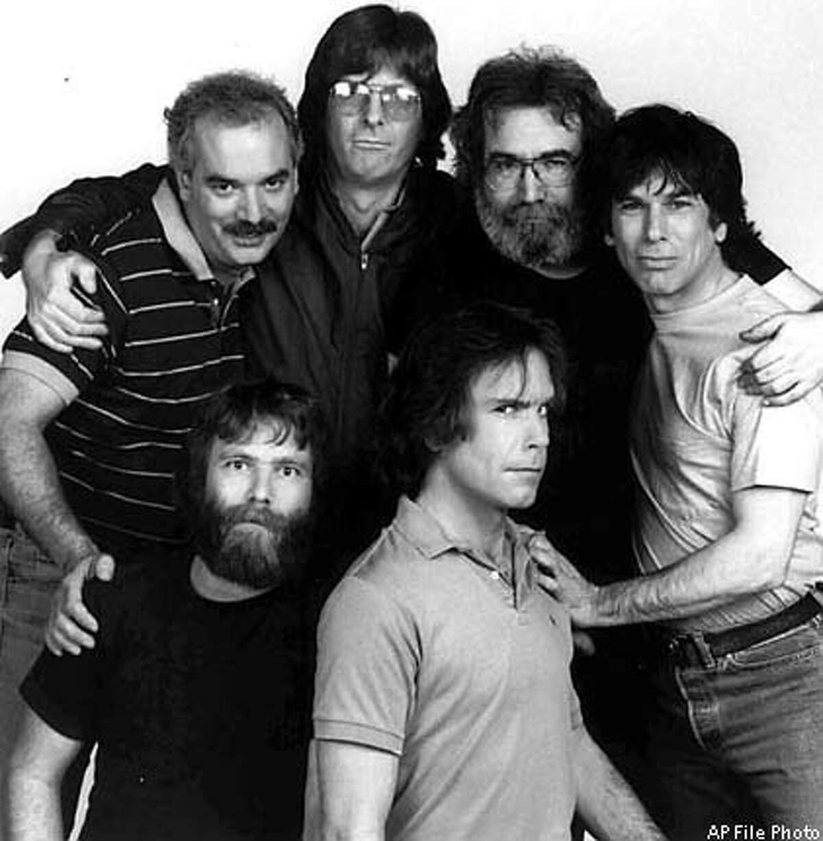 ** FILE ** Members of the Grateful Dead pose in a1985 photo in Marin County, Calif. From left, back row, are Bill Kreutzman, Phil Lesh, Jerry Garcia, and Mickey Hart. In front are Brent Mydland, left, and Bob Weir. After lead singer Jerry Garcia's death in 1995, the Grateful Dead retired from touring. But every now and then The Other Ones, the band's surviving members, put on a show. Bassist Phil Lesh, guitarist Bob Weir and drummers Bill Kreutzman and Mickey Hart quickly sold 70,000 tickets to two shows Aug. 3-4, 2002 in East Troy, Wis. (AP Photo)