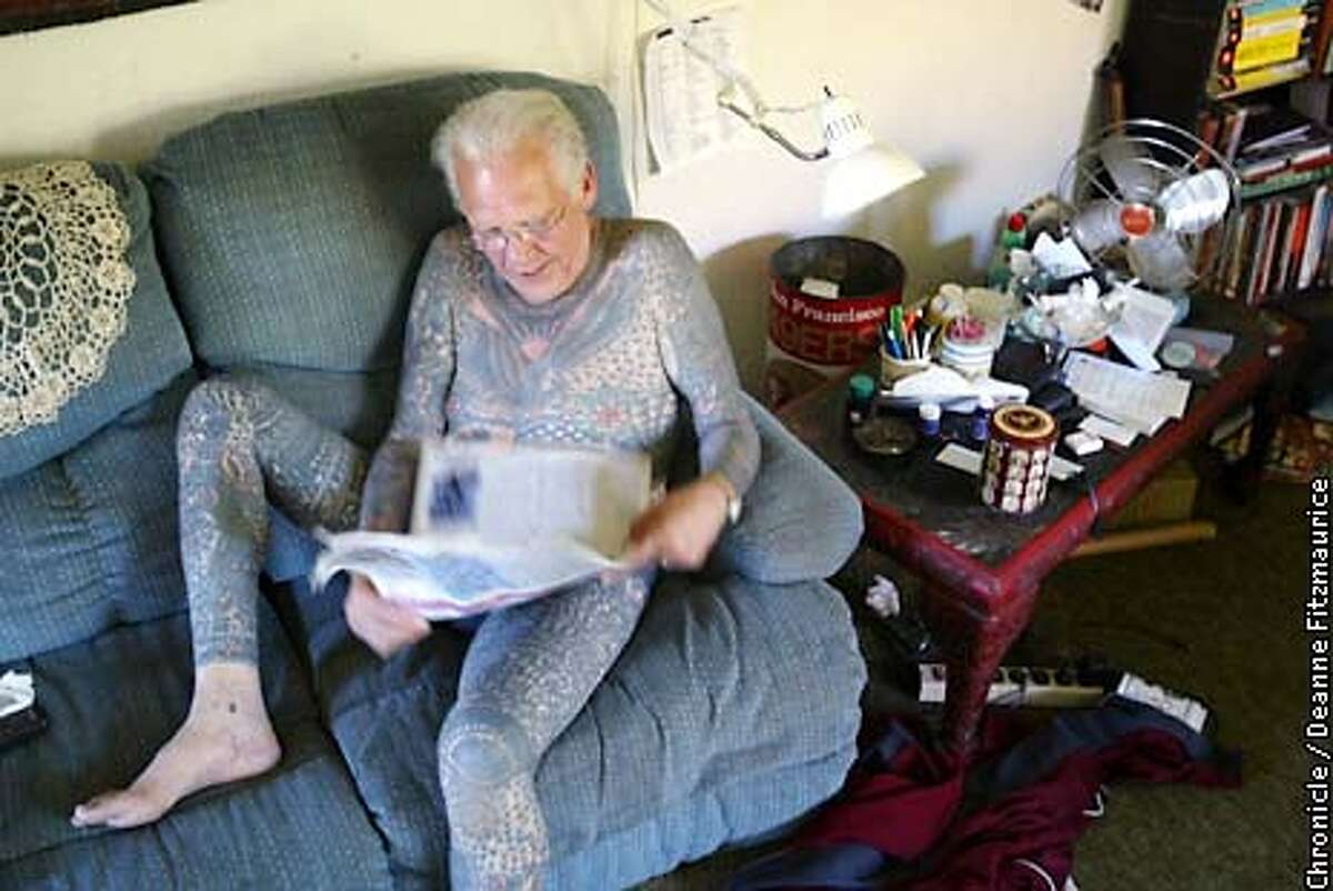 (uncorrected color) Lyle Tuttle, legendary tattoo artist, flips through the newspaper while sitting on the couch in his Ukiah home. CHRONICLE PHOTO BY DEANNE FITZMAURICE