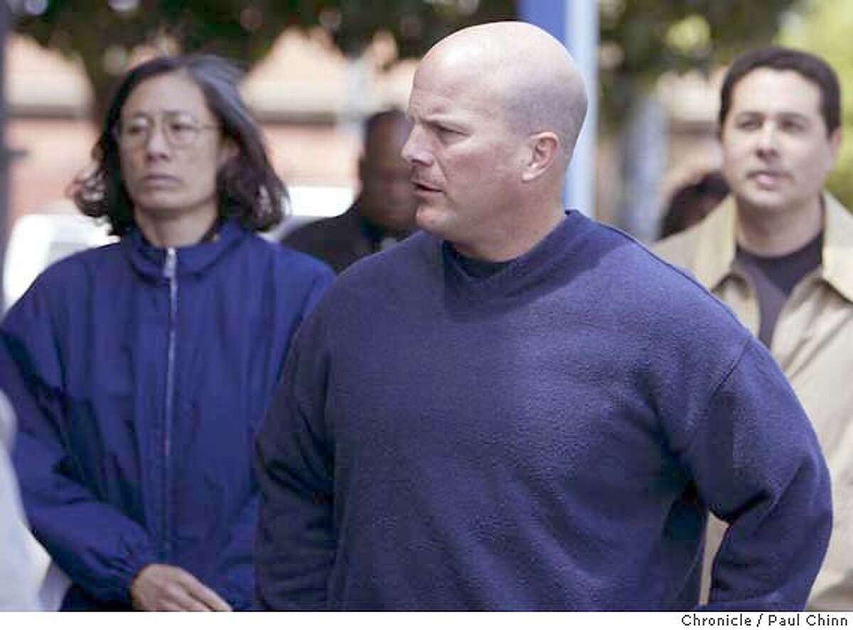 Police chief Heather Fong (left) walked behind deputy chief Greg Suhr on their way to the meeting at SFPOA headquarters. (The man at far right is unidentified). The SF Police Officer's Association and DA Kamala Harris hold separate news conferences to comment on police officer Isaac Espinoza's shooting death on 4/21/04 in San Francisco. PAUL CHINN/The Chronicle