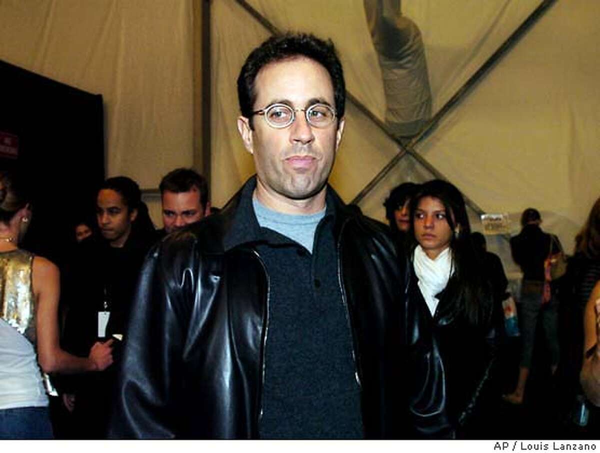 Jerry Seinfeld arrives backstage before the start of the Narciso Rodriguez Fall/Winter 2004 collection, Tuesday, Feb. 10, 2004, in New York. (AP Photo/Louis Lanzano)