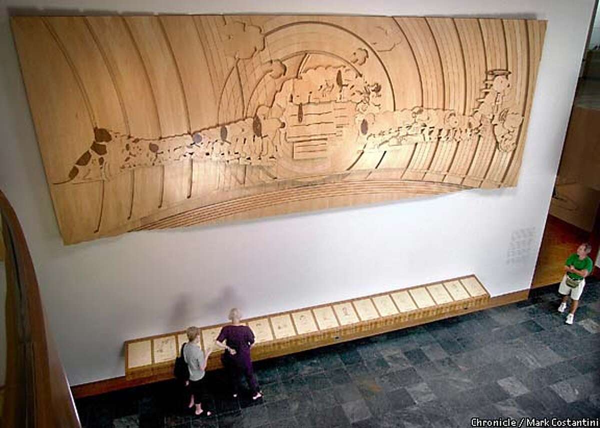 A carved mural by Japanese artist Yoshiteru Otani portrays the evolution of Snoopy from his origin (as Spike, Schulz's childhood pet) through the exuberant beagle's modern look. Chronicle photo by Mark Costantini