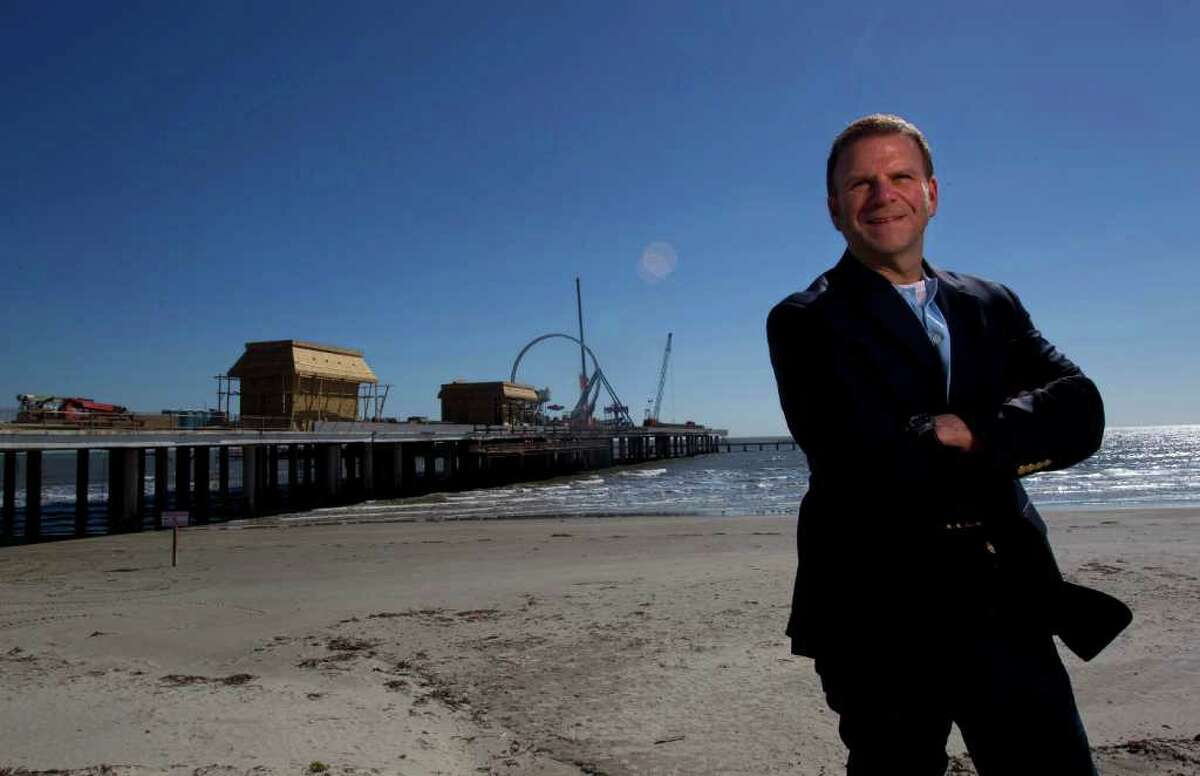 Portrait of entrepreneur, developer and restauranteur Tilman Fertitta next to his latest venture Pleasure Pier along Seawall and 25th St. at the former location of the Flagship Hotel Saturday, Jan. 28, 2012, in Galveston. The pier will be an entertainment destination with carnival rides, games and food including a Bubba Gump Shrimp Co. restaurant. ( Johnny Hanson / Houston Chronicle )