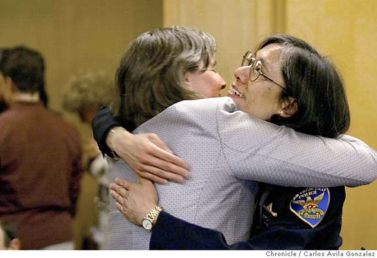 Newly-confirmed San Francisco Chief of Police, Heather Fong, gets a hug from Deputy City Attorney, Margaret Baumgartner, as Fong stopped to thank the public for their support as she was named Police Chief on Wednesday, April 14, 2004. Photo taken on 04/14/04 in San Francisco, Ca. Photo By Carlos Avila Gonzalez / The San Francisco Chronicle