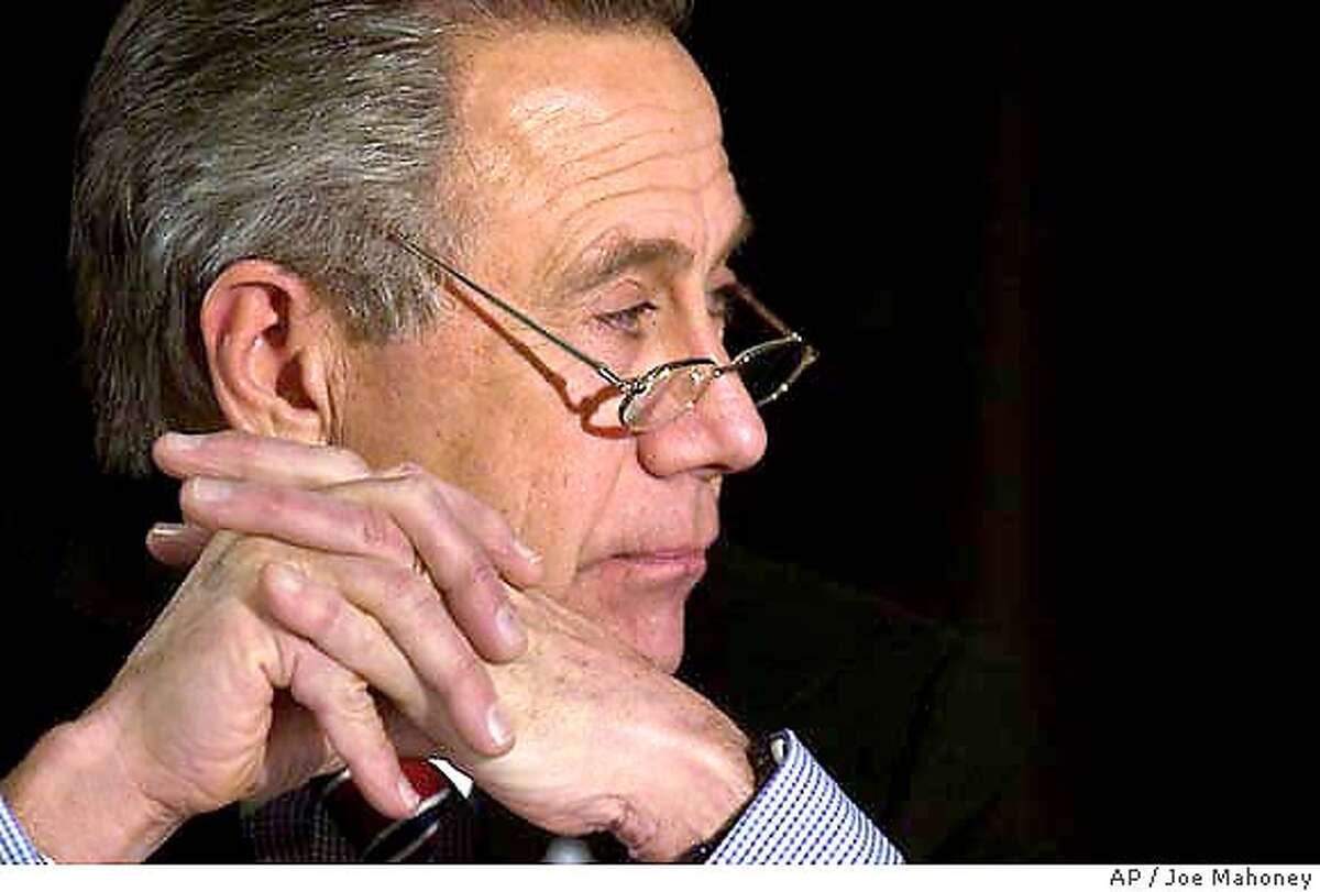** FILE ** Phil Anschutz listens to a question in Colorado Springs, Colo., May 22, 2002. Anschutz, billionaire investor, Qwest Communications founder, and professional sports team owner, has purchased the San Francisco Examiner from the Fang family with intentions of rebuilding the once-mighty daily, the parties announced Thursday, Feb. 19, 2004. (AP Photo/Rocky Mountain News, Joe Mahoney) Florence Fang (left), the current owner, tells of the sale, while the Examiner's new chairman, Bob Starzel, listens. Philip Anschutz (above) owns sports teams and cinema chains. This is his first paper.