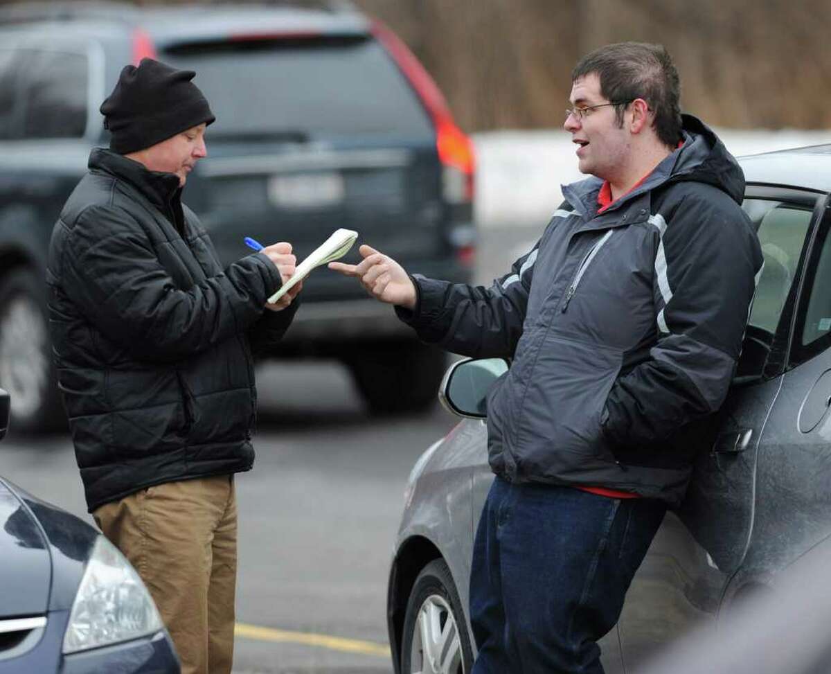 Diabetic test strips buyer Brian "Jake" Tucker, of Rotterdam, right, talks to Times Union reporter Paul Grondahl at the Colonie Library parking lot Wednesday, Dec. 25, 2011 in Colonie, N.Y. (Lori Van Buren / Times Union)