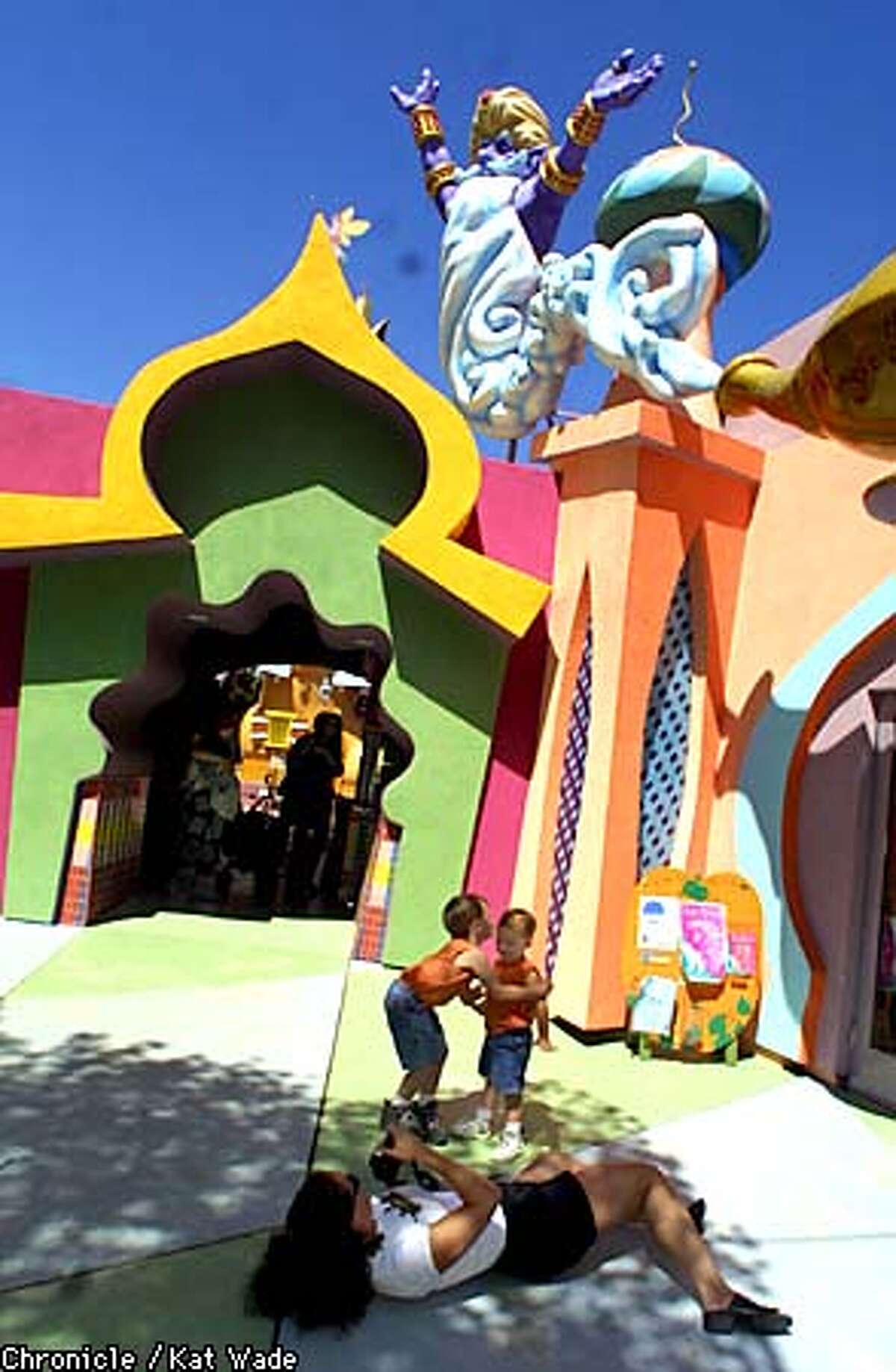 Brothers, (L to R) Kohl (CQ, 5, and Craig, 3, Thorlakson, of Trabuco Canyon California pose for a photo fo their mother Andrea at the new Fairyland plaza featureing Aladin and the genie. SAN FRANCISCO CHRONICLE PHOTO BY KAT WADE