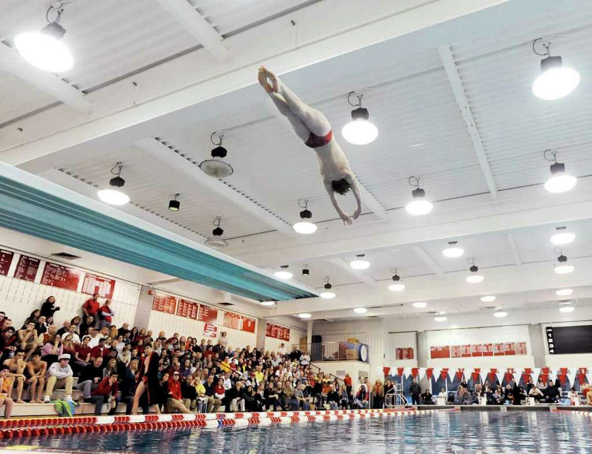 Greenwich High School diver Jeff Aselin soars above the GHS pool during the diving competition in the boys high school swim meet between Fairfield Prep and Greenwich High School at Greenwich, Saturday, Jan. 28, 2011.