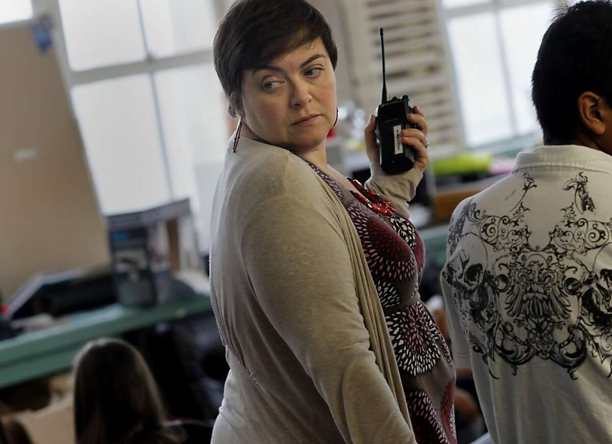Social Worker Erika Rubinstein watches students as she supervises Game Club, a weekly event at the school. At Aptos Middle School in San Francisco, Calif., social workers and researchers are working with students who have Post-traumatic Stress Disorder or similar trauma induced problems.