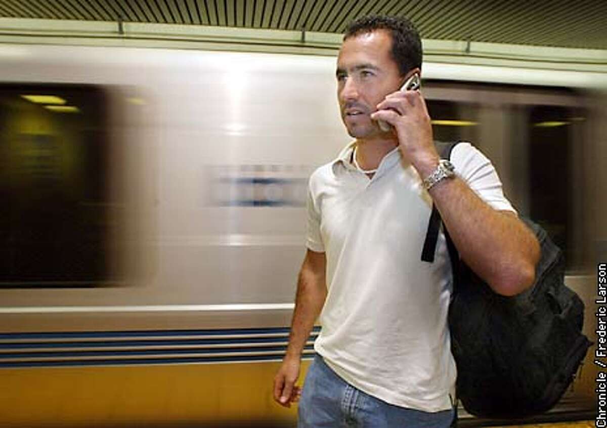 : Jerry Lujan talks on his cell phone at the BART Powell Street platform where AT&T has installed antennas that provides service underground. Chronicle photo by Frederic Larson