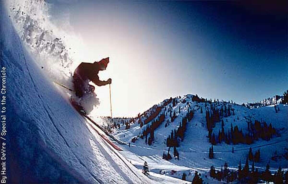 Alone skier blast through fresh powder atop Squaw Valley USA. By Hank DeVre/Special to the Chronicle