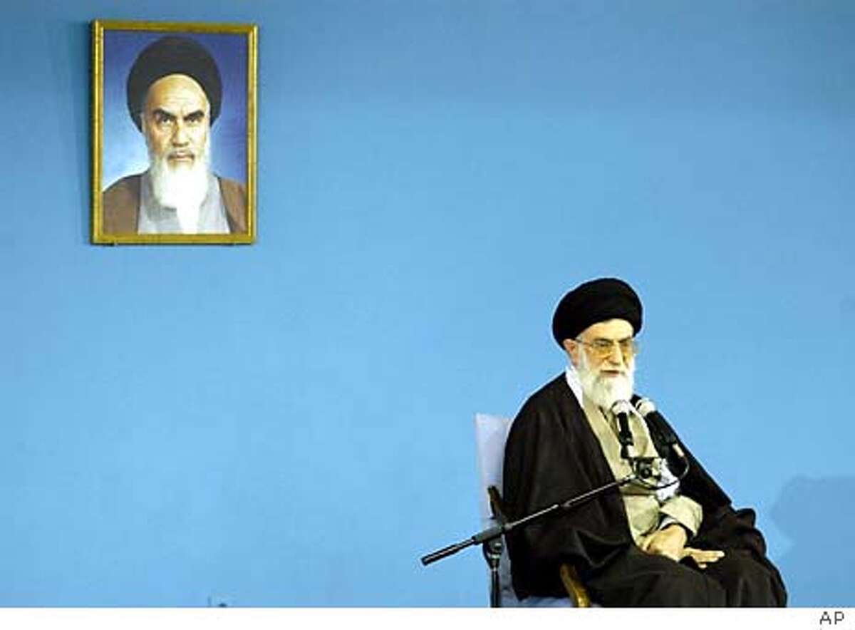 Iran's supreme leader Ayatollah Ali Khamenei, delivers his speech during a public meeting in Tehran Wednesday Feb. 4, 2004. Khamenei, has ordered a review of the candidates disqualified from legislative elections. At top left is a photo of Iran's late revolutionary leader Ayatollah Khomeini. (AP Photo/STR) Ayatollah Ali Khamenei, Irans religious leader, broke the impasse between reformists and the conservative Guardian Council, which banned thousands of reformist candidates.