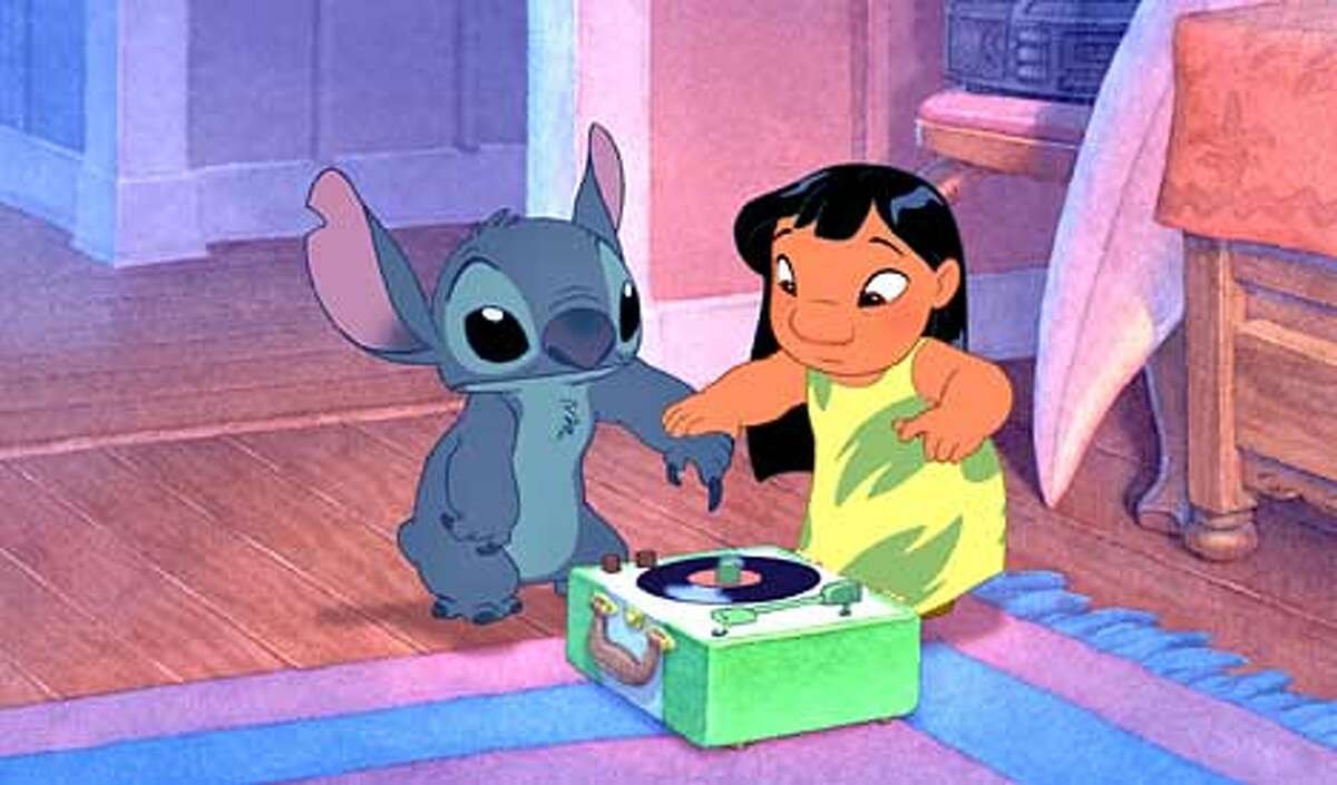 LILO & STITCH - Photo #172 A Hawaiian girl named Lilo discovers that Stitch can do a �stupid pet trick� when he uses his nail to play a phonograph record and the sound comes out of his mouth in this scene from Walt Disney Pictures� delightful new animated comedy, �Lilo & Stitch.� (HANDOUT PHOTO)