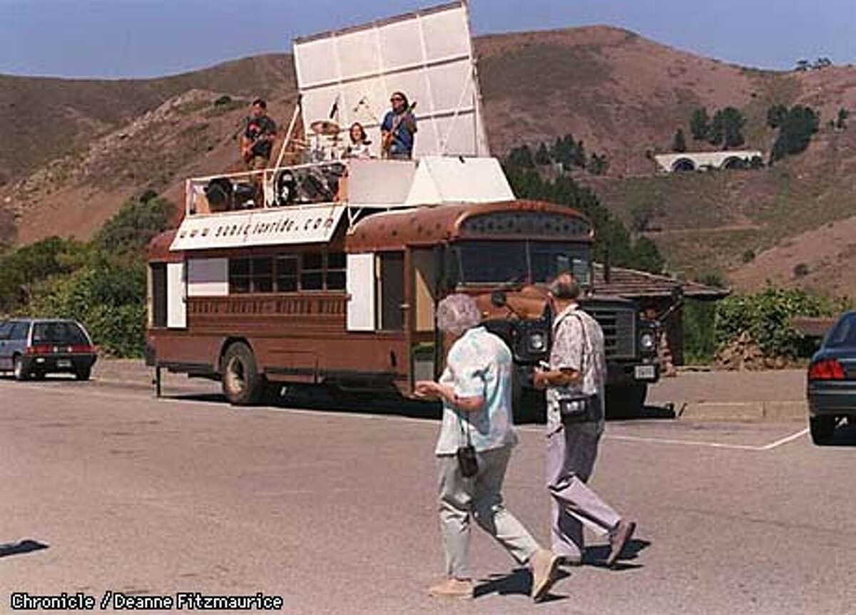 Sonic Joyride, an unknown band touring the country in a bus that turns into their stage, sets up at Vista Point with Marin Headlands as a background. CHRONICLE PHOTO BY DEANNE FITZMAURICE