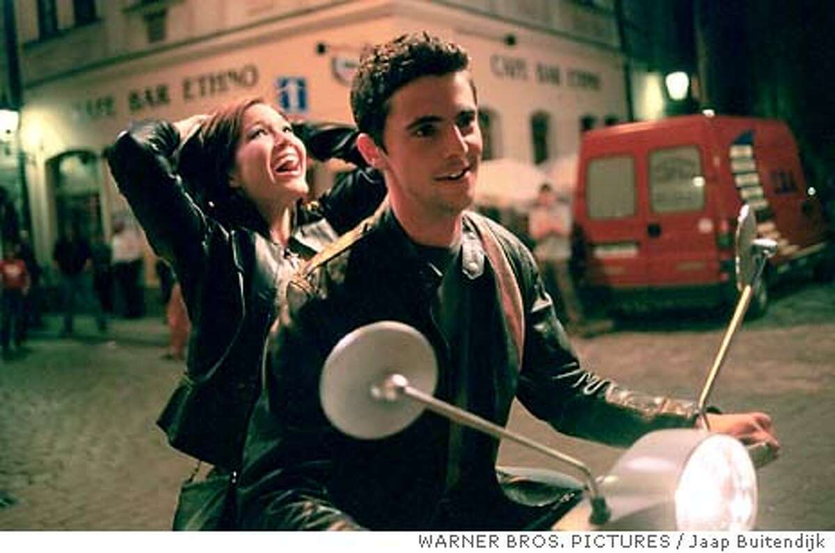 Mandy Moore and Matthew Goode star in Alcon Entertainments young adult romantic comedy "Chasing Liberty." (WARNER BROS. PICTURES / Jaap Buitendijk) Mandy Moore escapes with Matthew Goode to freedom -- or so she thinks -- in Chasing Liberty.