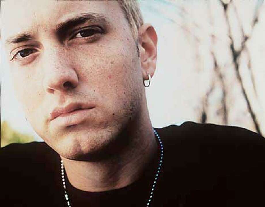 Pomp, irony under Eminem's big top / Rapper takes on ...