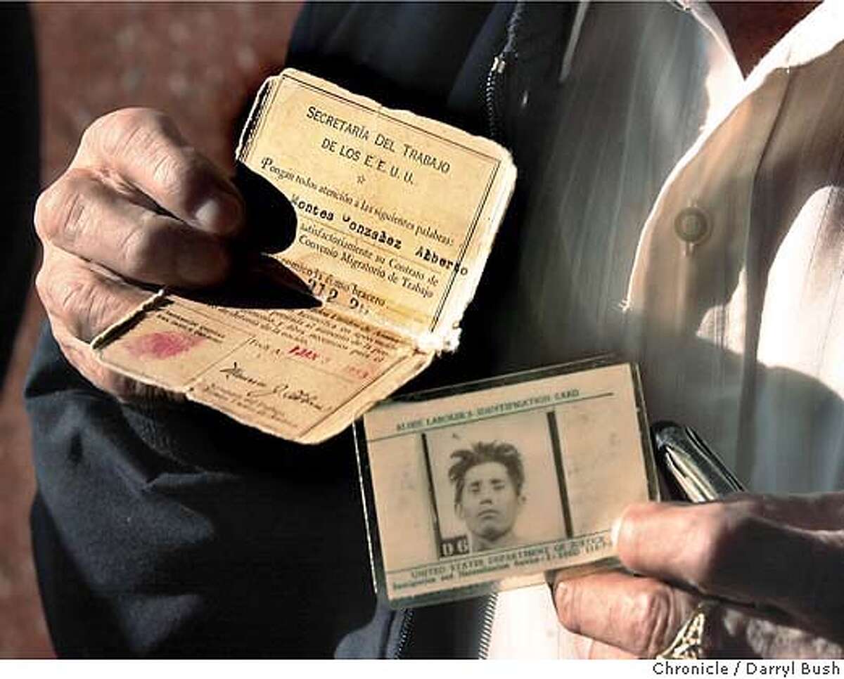 Bracero Alberto Montes, 75, of San Jose, holds two work permits from the U.S. Dept. of Labor at a meeting of several braceros and surviving family members where they signed a letter provided by organizer Jose Sandoval outside the Mexican consulate in San Jose. The letter to Mexican president, Vicente Fox, is requesting payment for the bracero program which decucted 10 percent of the workers' pay in the US and was supposed to be held for them in Mexico. 1/13/04 in San Jose. DARRYL BUSH / The Chronicle
