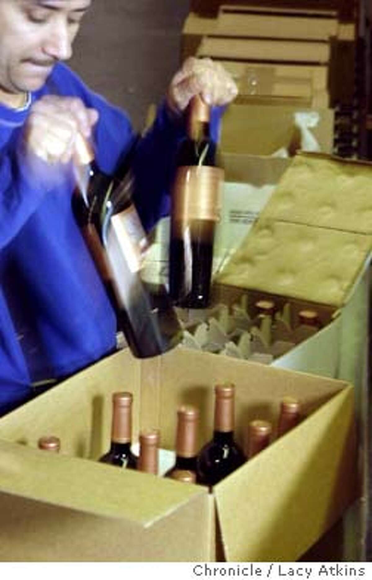 CLUBS_011_.jpg Ivan Cano packages bottles of wine for a wine club member shipment at the Aero Packing Company, Monday Jan.5, 2004, in American Canyon. AERO Packing Company assembles wine club shipments, Monday Jan. 5, 2004, in American Canyon. Lacy Atkins / The Chronicle ProductNameChronicle Ivan Cano of Aero Packing in American Canyon readies a shipment for wine club members wanting something special.