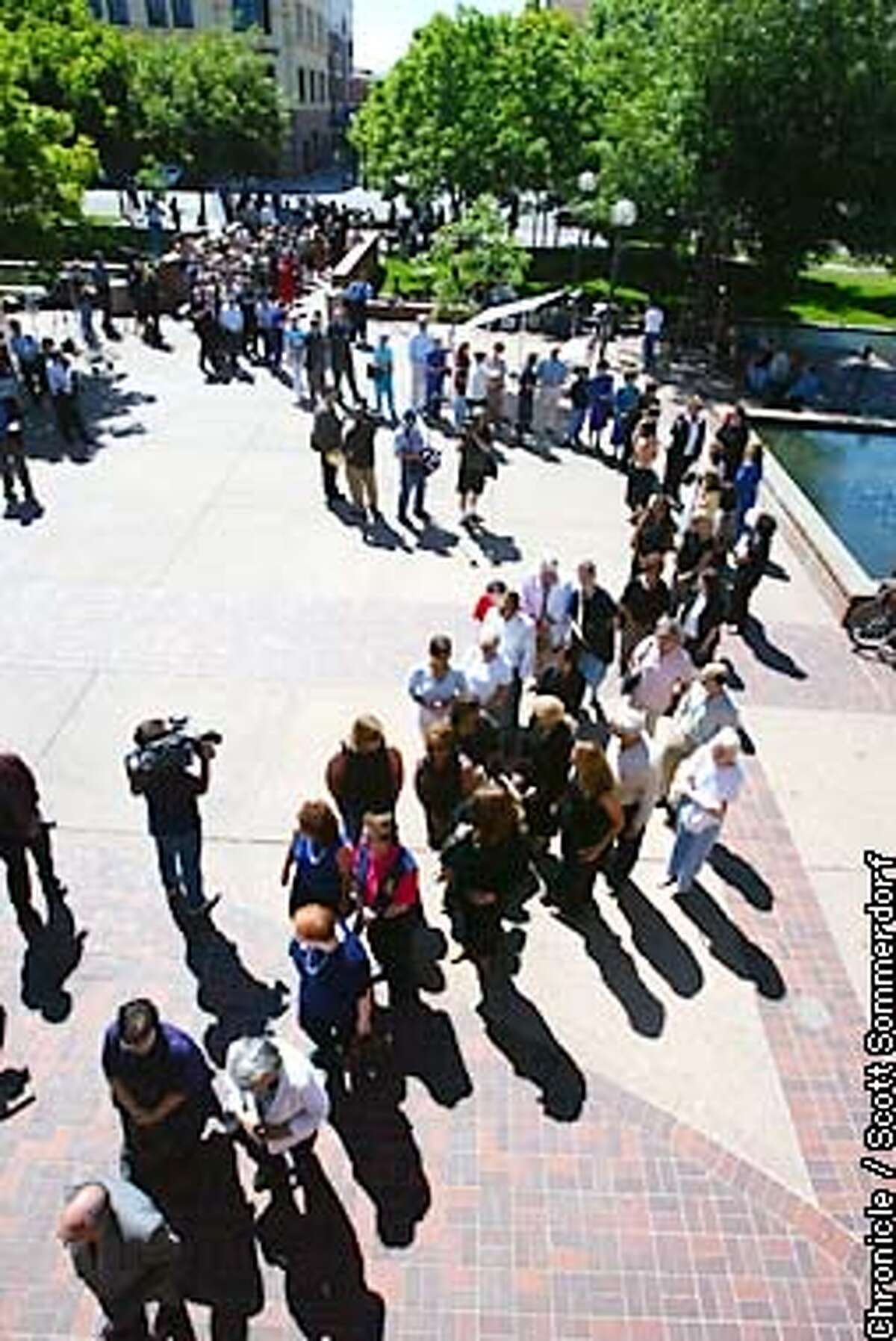 A line forms outside the Centre Plaza building where the memorial service was held. A public memorial service was held for Chandra Levy this morning in Modesto. CHRONICLE PHOTO BY SCOTT SOMMERDORF