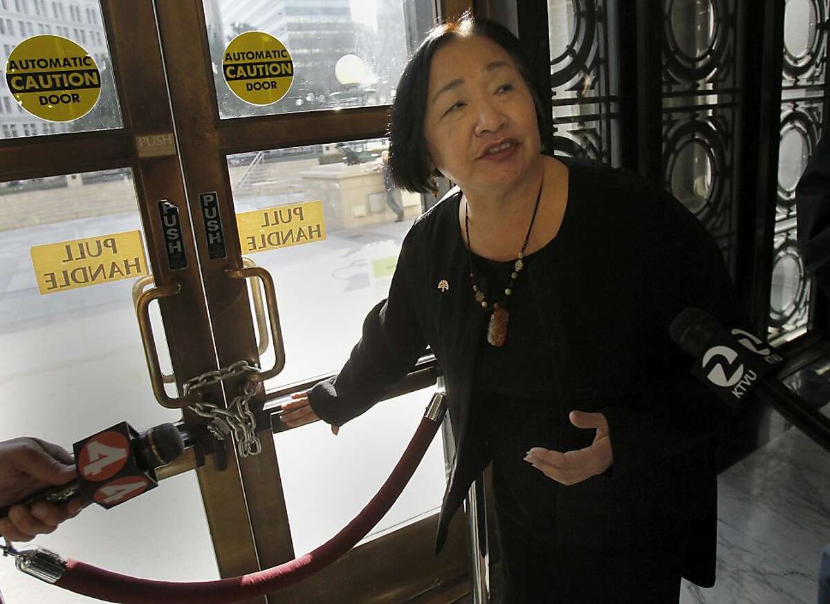 Mayor Jean Quan showed the steel chain holding the doors to City Hall closed after a protester managed to use a crow bar to gain entry Saturday night. Oakland, Calif. Mayor Jean Quan led a tour of the damage done inside Oakland City Hall Sunday January 29, 2012 by occupy protesters Saturday night.