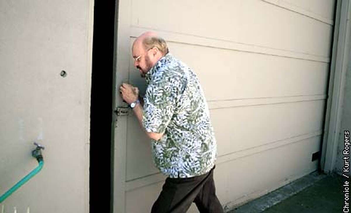 John Martin closes the door of his empty warehouse spaces in Santa Rosa at Black Sparrow press where after 36 years in business has sold to HarperCollins. Photo By Kurt Rogers