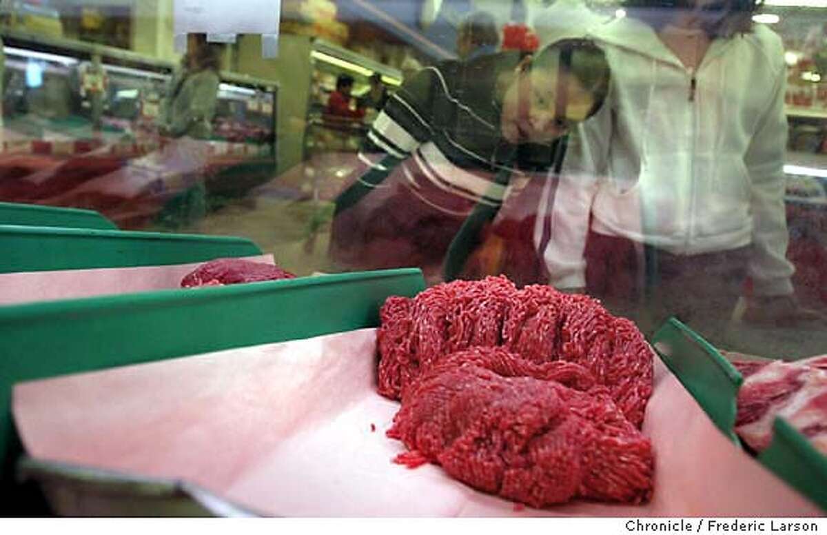 ; Customer(s) (ID OF CUSTOMER WAS NOT GIVEN but she was aware of photo being taken, language difficulity) inspect the ground beef sold Lion Market in San Jose. The store claim sales have not been affected by the the Mad Cow scare. Reaction to mad cow disease at various ethnic restaurants and food markets in Santa Clara county have been identified as places where tainted meat was sold. � Mad Cow Disease, is a chronic progressive degenerative disease affecting the central nervous system of cattle. There is no treatment, and affected cattle die. BSE was first officially recognized in the United Kingdom (UK) in November 1986. Epidemiologic data suggest that BSE in Great Britain is a common-source epidemic involving animal feed containing BSE- or scrapie-contaminated meat and bone meal as a protein source. Changes in rendering practices in the early 1980's may have potentiated the agent's survival in meat and bone meal City:� 1/3/04, in San Jose, CA. City:� . Frederic Larson/The Chronicle;