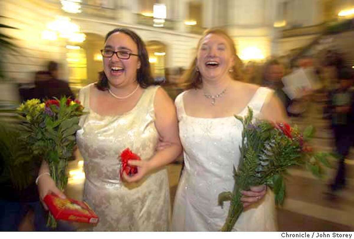 Emily Drennen (right) and Lindasusan (sic) Ulrich from San Francisco, together for 6 years, have a laugh after getting married in the rotunda of San Francisco City Hall. Same sex marriages taking place in San Francisco's City Hall. John Storey/The Chronicle