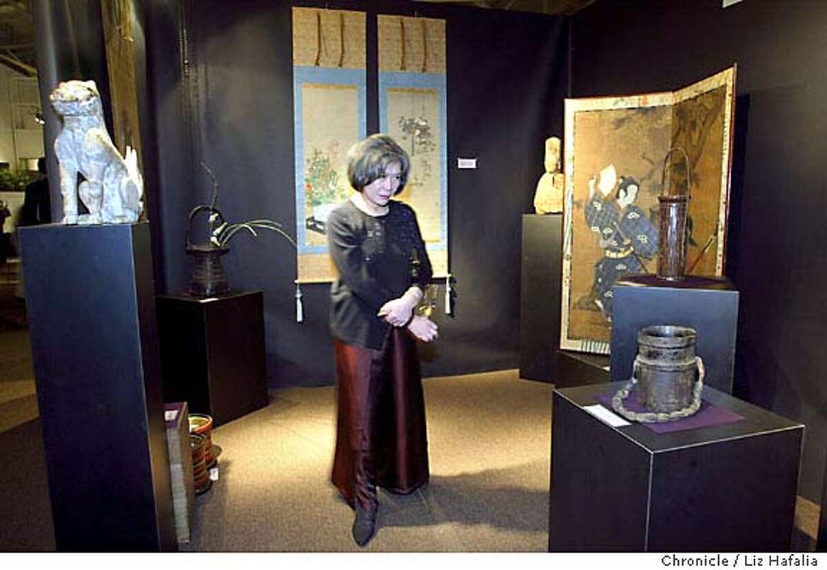 PARTY15_066_LH.JPG Emily Sano, director of the Asian Art museum, looking at items displayed at theArts of Pacific Asia Show in the Festival Pavilion at Fort Mason. The art show and sale benefits the Asian Art Museum. Shot {02/05/04} in {San Francisco} LIZ HAFALIA/THE CHRONICLE