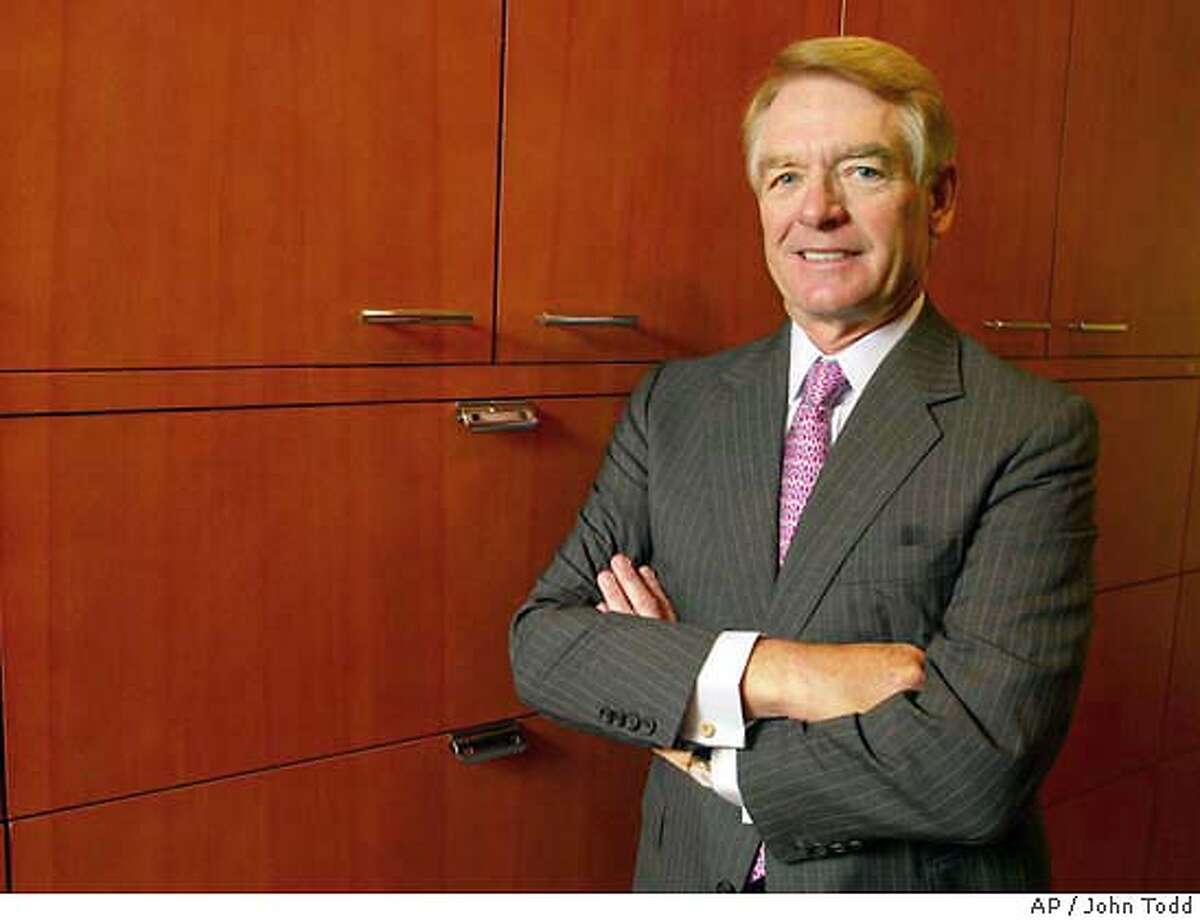 Charles Schwab poses at his office in San Francisco, Calif., Monday, July 15, 2002. Although he moved into the top income bracket long ago, billionaire Charles Schwab says he still relates to the small investors who helped transform his discount stock brokerage from a quirky upstart with four employees in 1971 to a financial services icon with 19,100 workers today. (AP Photo/John Todd) CAT