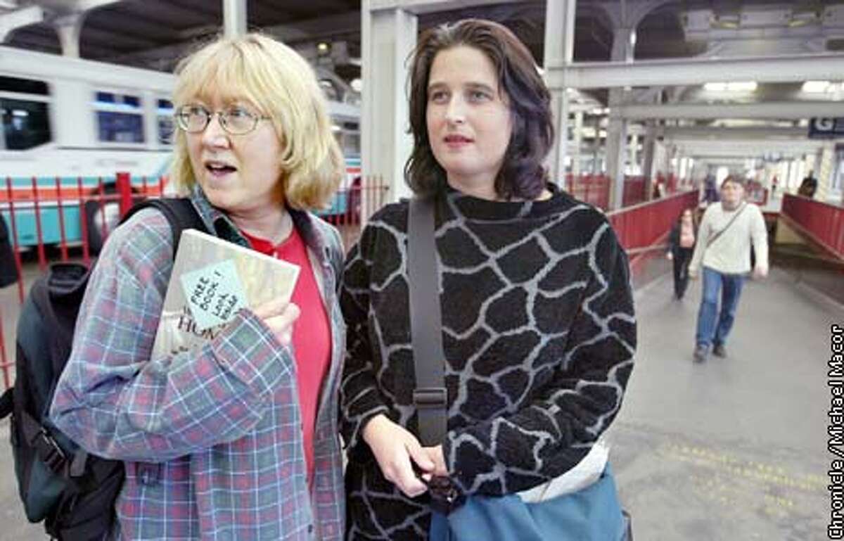 Judy Hardin, left, and Jo Beaton scope out the Transbay Terminal in San Francisco for their next drop for BookCrossing.com. Chronicle photo by Michael Macor