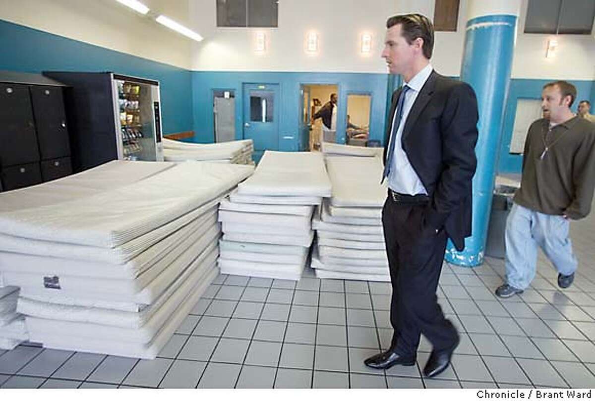 homeless001_bw.jpg Mayor Gavin Newsom made a surprise inspection of two San Francisco homeless shelters Thursday. Here at MSC South located at Fifth and Bryant Streets he toured the biggest city shelter. Here he takes a look at the mattresses stacked on the bottom floor with social services manager Nathan Lawson. BRANT WARD / The Chronicle Mayor Gavin Newsom passes stacks of mattresses on a tour of the city homeless shelter at Fifth and Bryant streets with social services manager Nathan Lawson. The mayor did surprise inspections of two San Francisco homeless shelters. ProductNameChronicle MANDATORY CREDIT FOR PHOTOG AND SF CHRONICLE/ -MAGS OUT