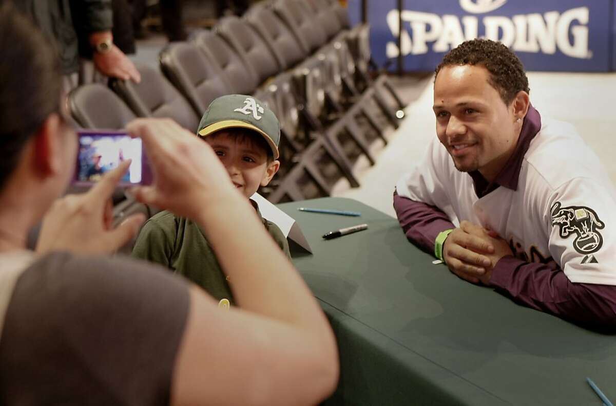 Coco Crisp helped a fan get a memorable picture. The Oakland A's held their annual FanFest at the Oakland Arena Sunday January 29, 2012 to delight of their fans.