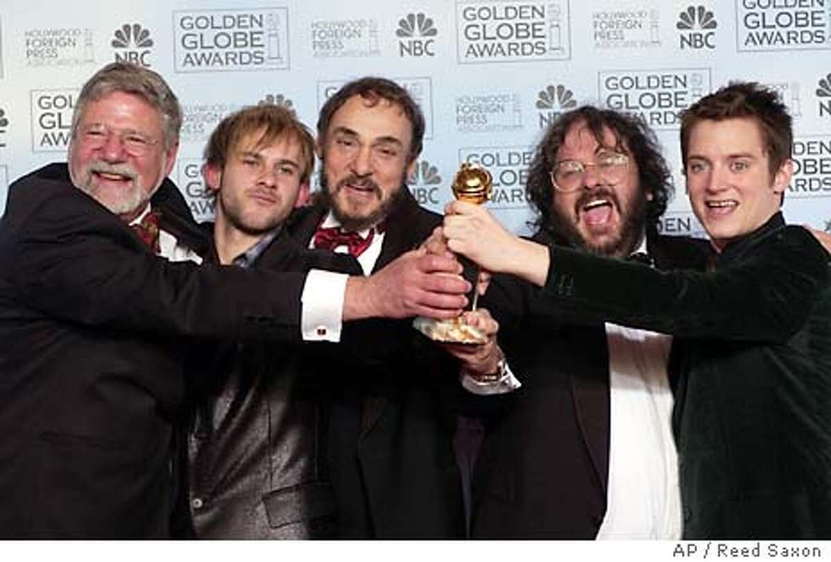 Director Peter Jackson, second from left, poses with the cast and crew of �The Lord of the Rings: The Return of the King,� at the 61st Annual Golden Globe Awards in Beverly Hills, Calif. Sunday, Jan. 25, 2004. Jackson won the award for best director. (AP Photo/Reed Saxon)